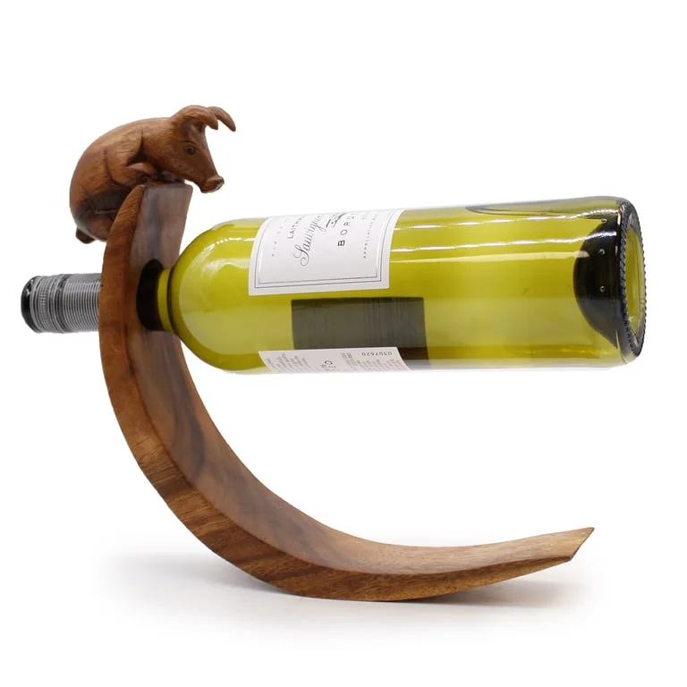 Pig-shaped balance wine holder for wine bottles.