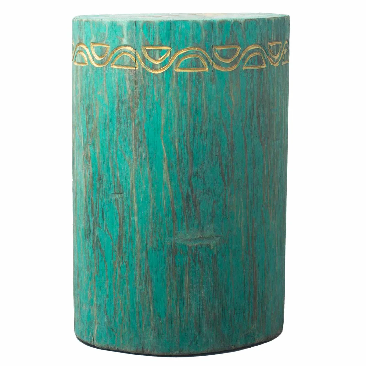 Turquoise tribal albasia wood stool with carved patterns shown from side angle on white background