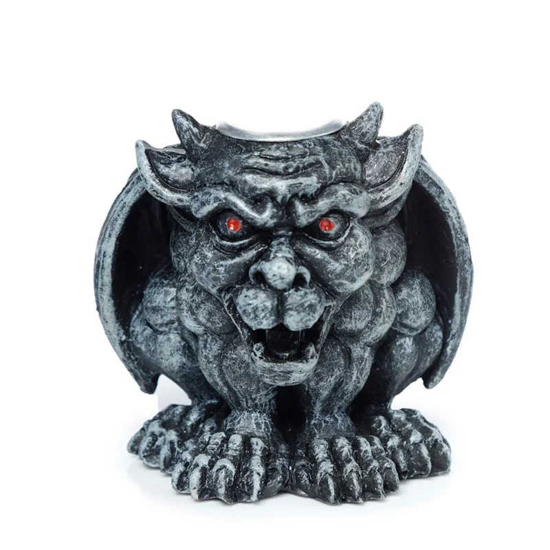 Gargoyle-shaped decorative incense burner designed for backflow incense cones on a plain background