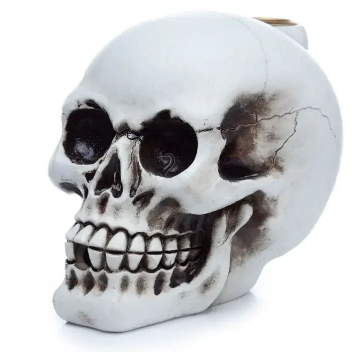 Ceramic skull-shaped backflow incense burner designed to create cascading smoke effect for aromatherapy