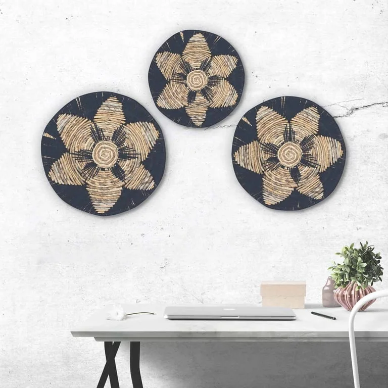 Black seagrass bowls forming a set of three bowls displayed as wall art
