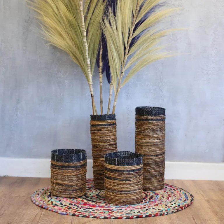 Banana leaf vase set with two vases and two decorative bins in natural leaf design