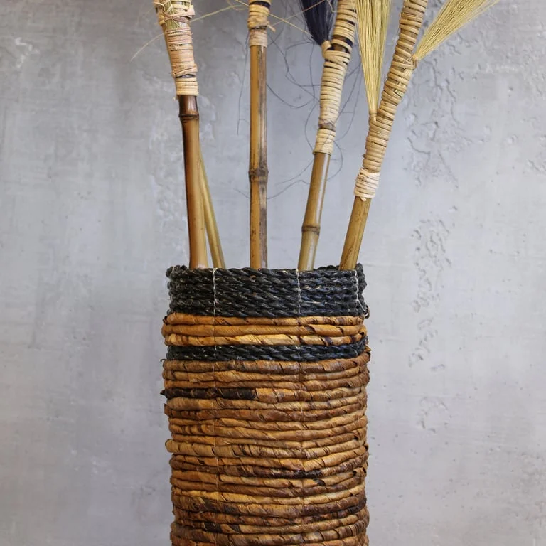 Banana leaf vase set showing two vases with green leaf design and two matching bins.