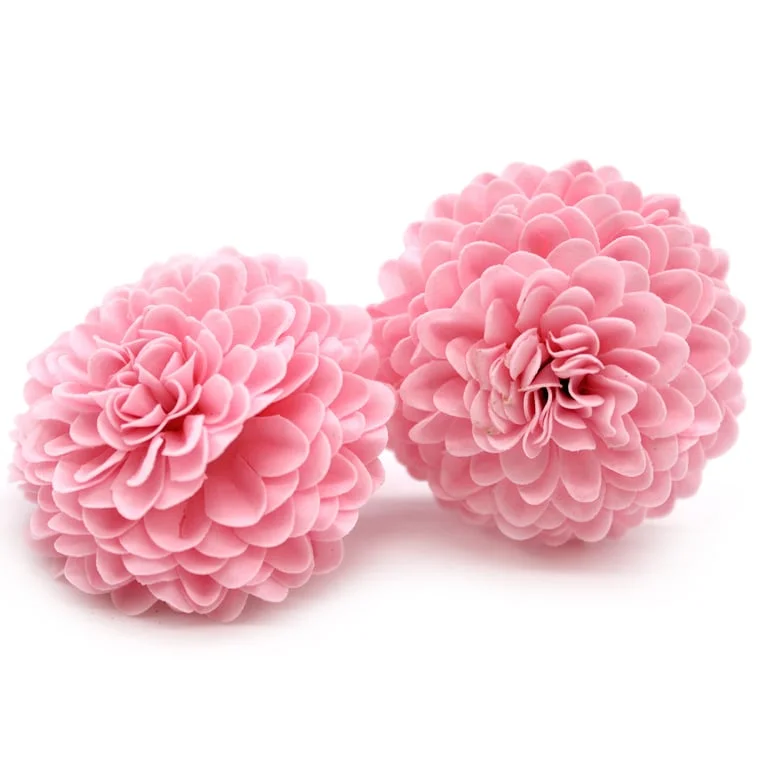 Light pink craft soap flower shaped like a small chrysanthemum.