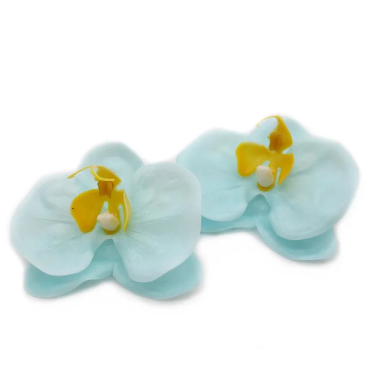 Blue soap flower shaped like a paeonia blossom, crafted from soap, displayed on a clear surface
