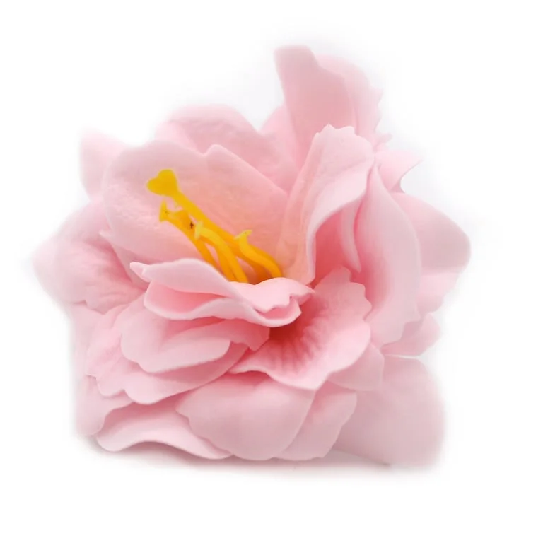 Small pink craft soap flower resembling a delicate peony blossom