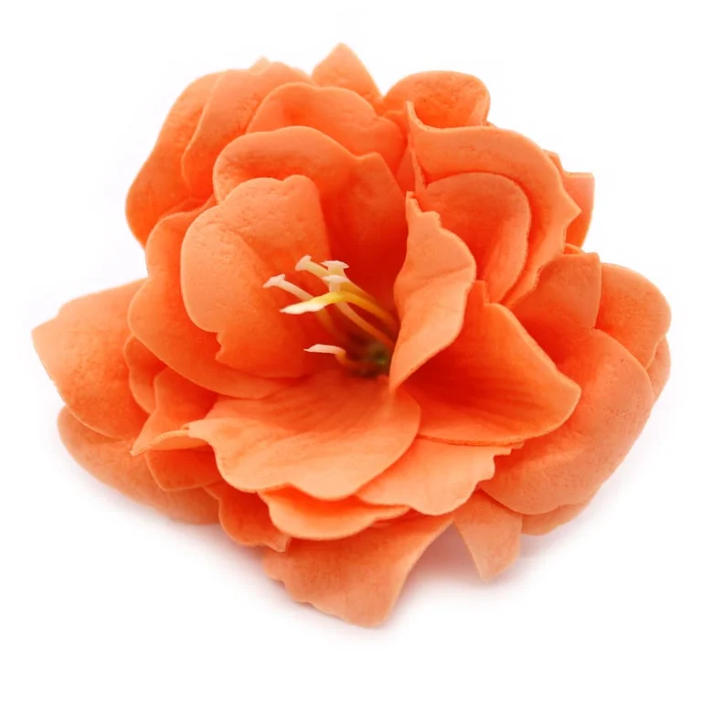 Orange craft soap flower shaped like a small peony