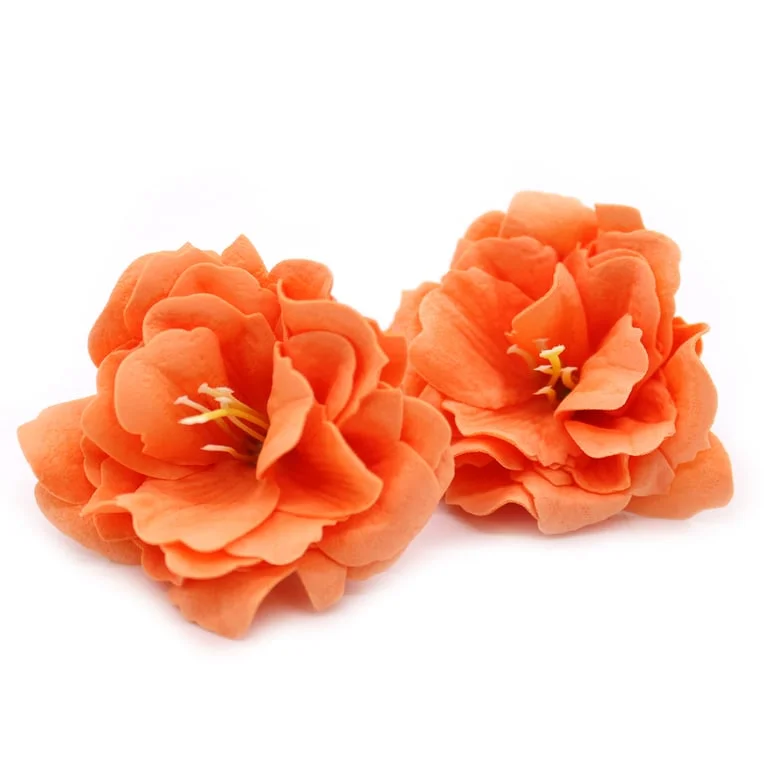 Orange craft soap shaped like a small peony soap, detailed petals visible.