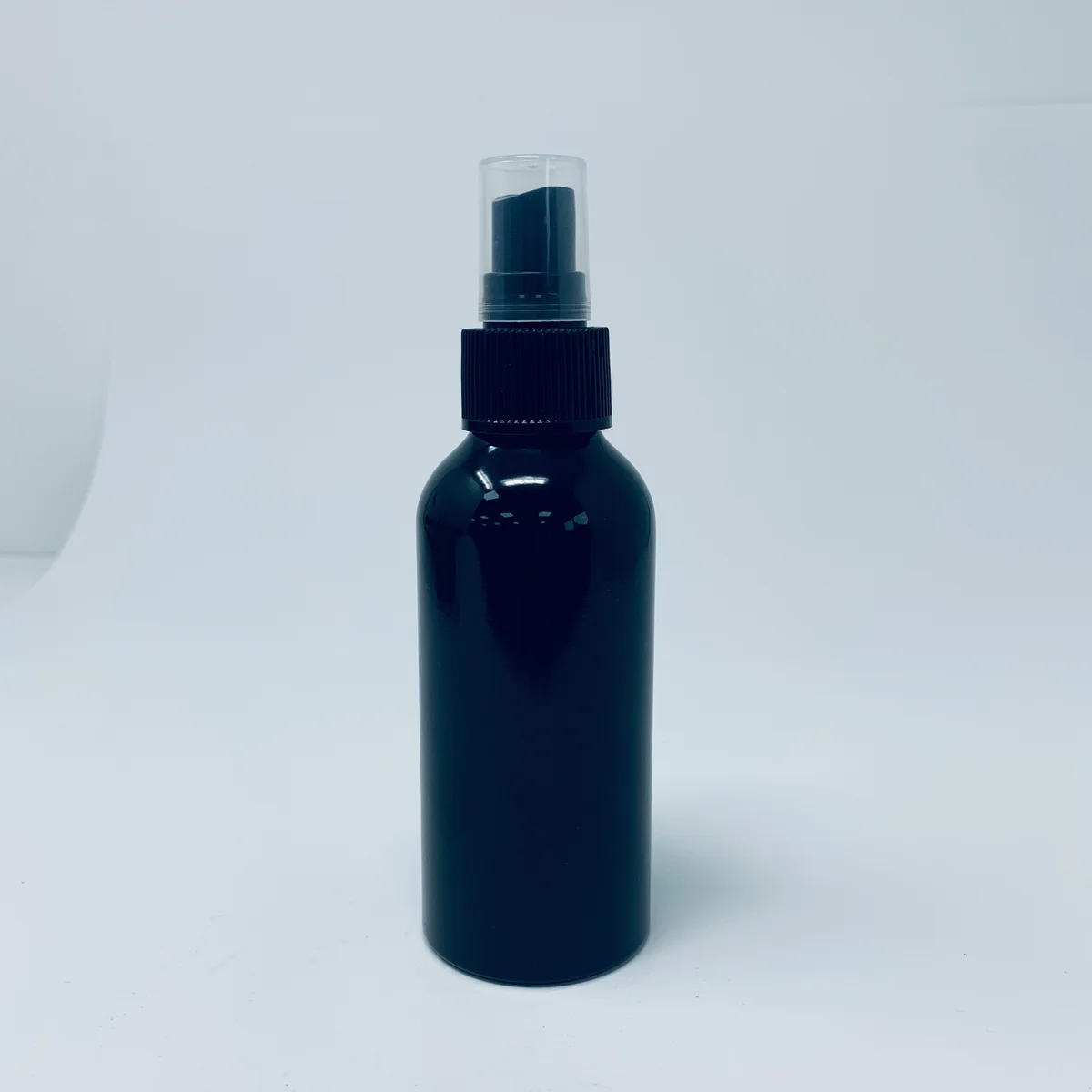 120ml black aluminium bottle with matching black spray cap shown against a white background