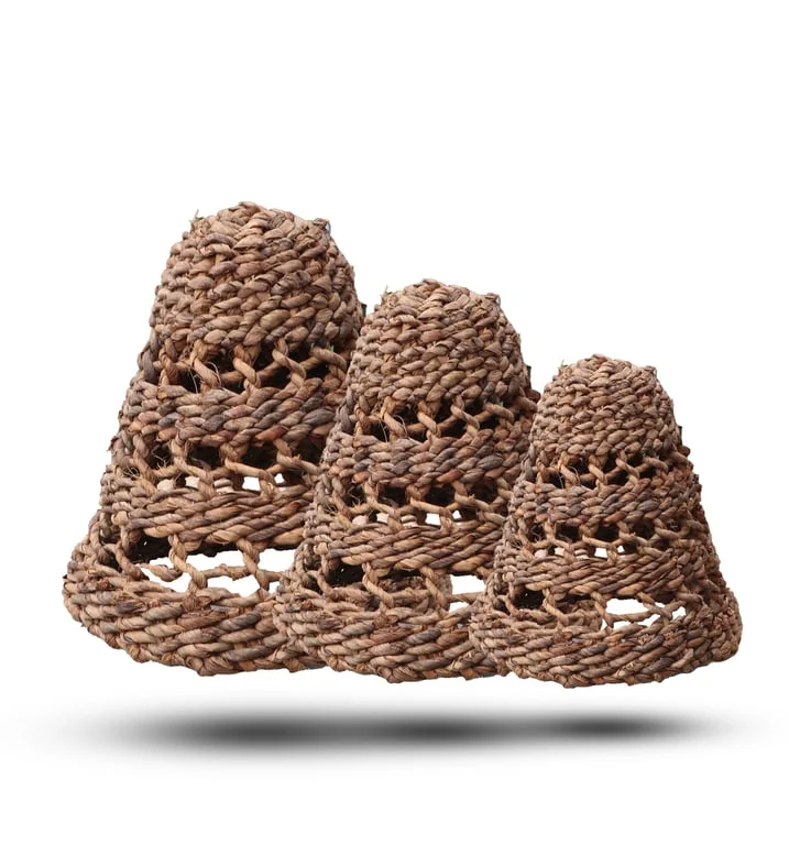 Set of three natural banana leaf lamp shades displayed together with soft lighting.