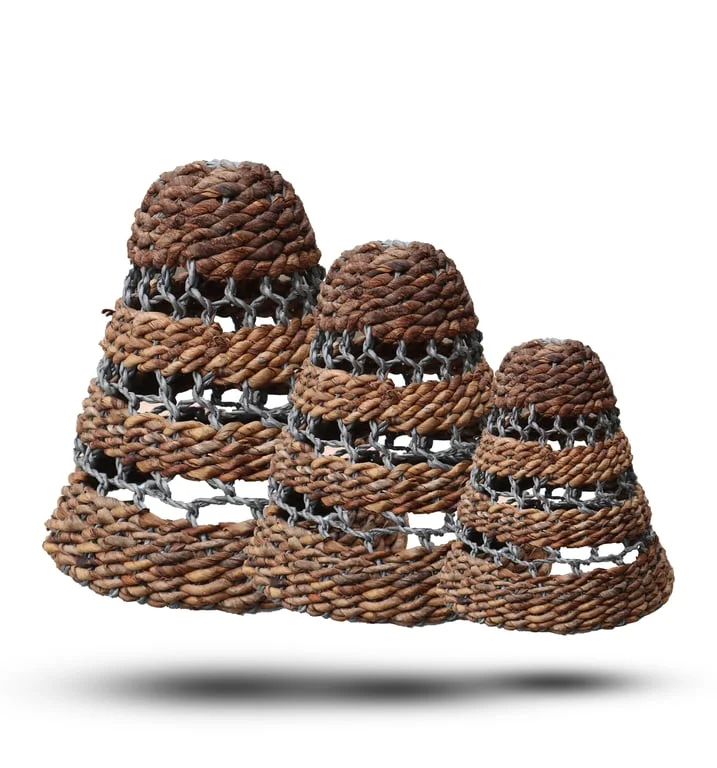 Set of three natural lamp shades featuring banana leaf and abubu raffia.