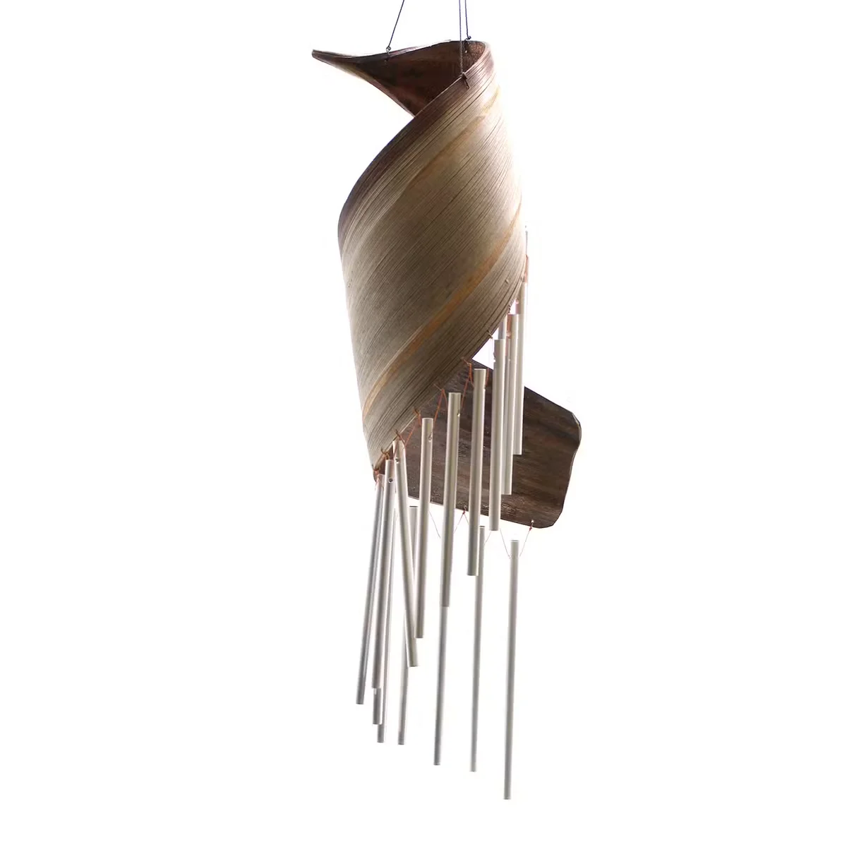 Close-up of natural material wind chimes made from coconut leaves hanging outdoors