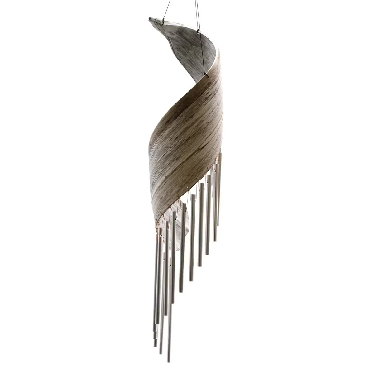 Whitewash coconut leaf decorative wind chimes hanging outdoors against a blurred background