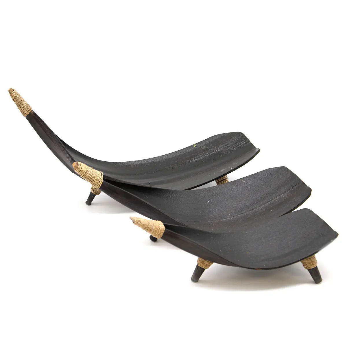 Chocolate coloured coconut leaf fruit bowl set with multiple bowls stacked together on a white background