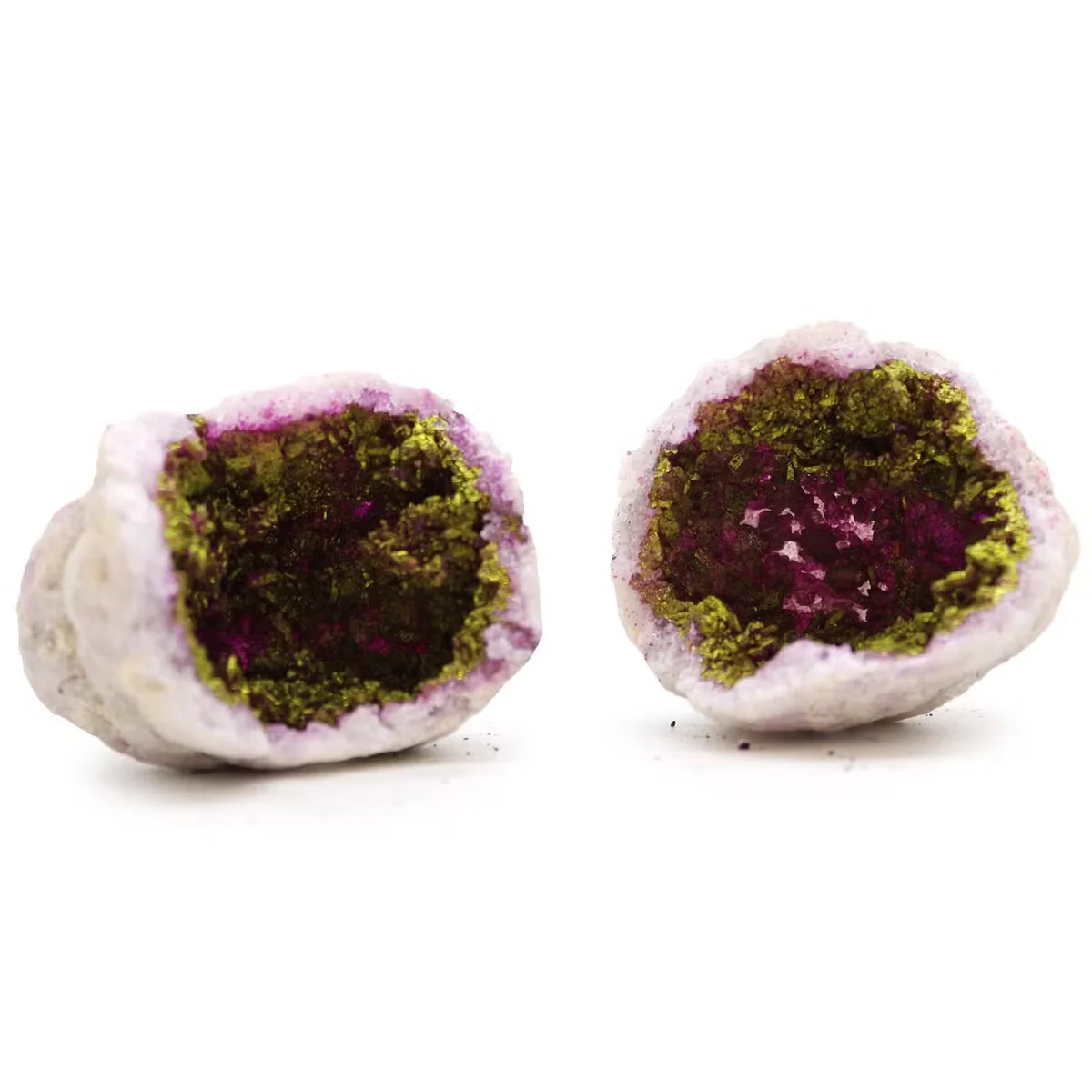 Pink and gold coloured calsite geode decorative rock ornaments with natural crystal formations on display