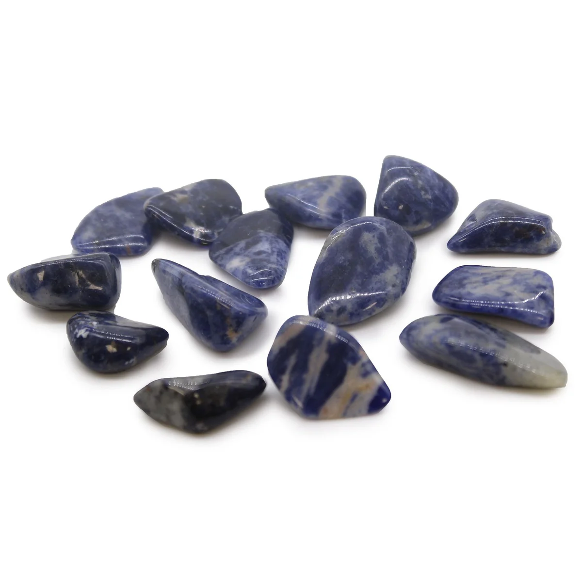 Smooth polished sodalite tumble stone with deep blue and white marbled patterns on a white background