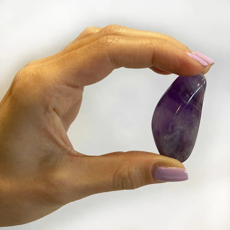 Ring featuring tumbled amethyst stones.