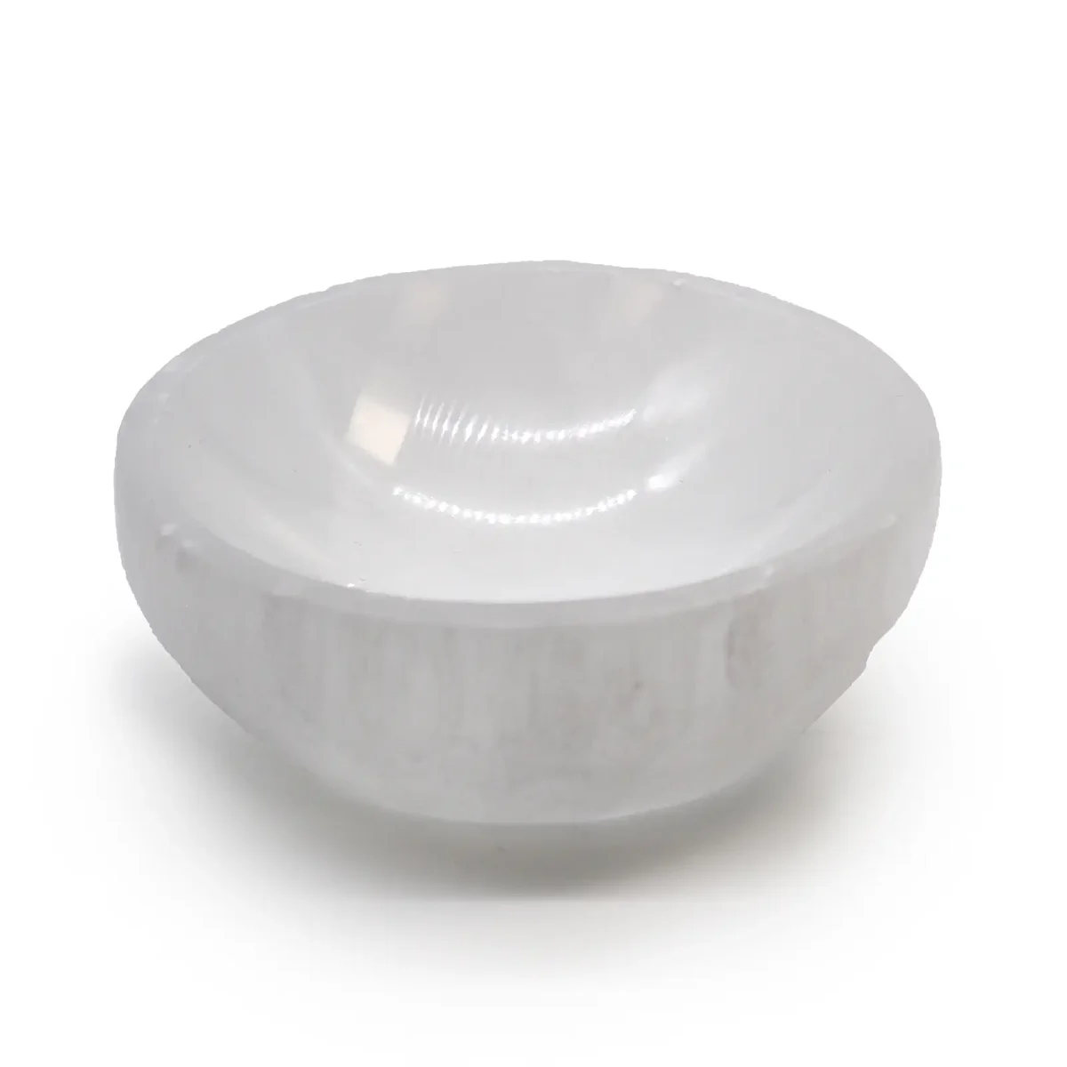 Decorative selenite bowl, round shape, smooth white translucent surface, 10cm diameter on plain background