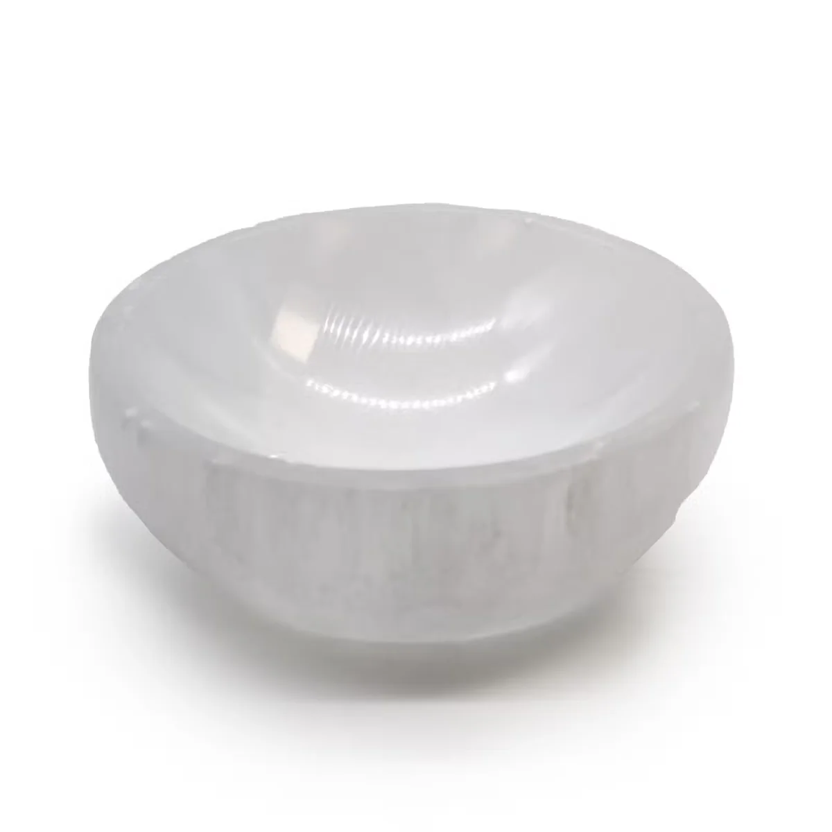 10cm round natural crystal bowl made from translucent selenite with smooth polished surface on white background