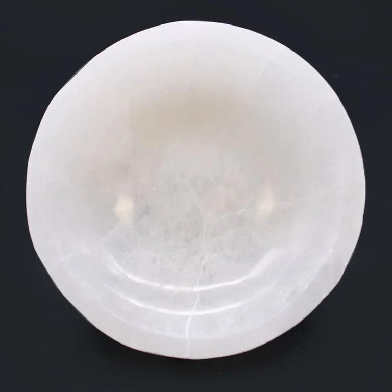 Selenite round bowl measuring 15cm diameter with smooth, translucent white crystal surface on plain background