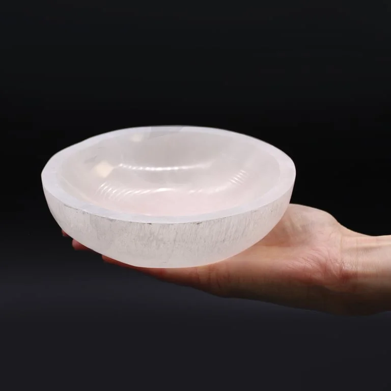 Decorative selenite bowl with a smooth round shape and 15cm diameter on a white background