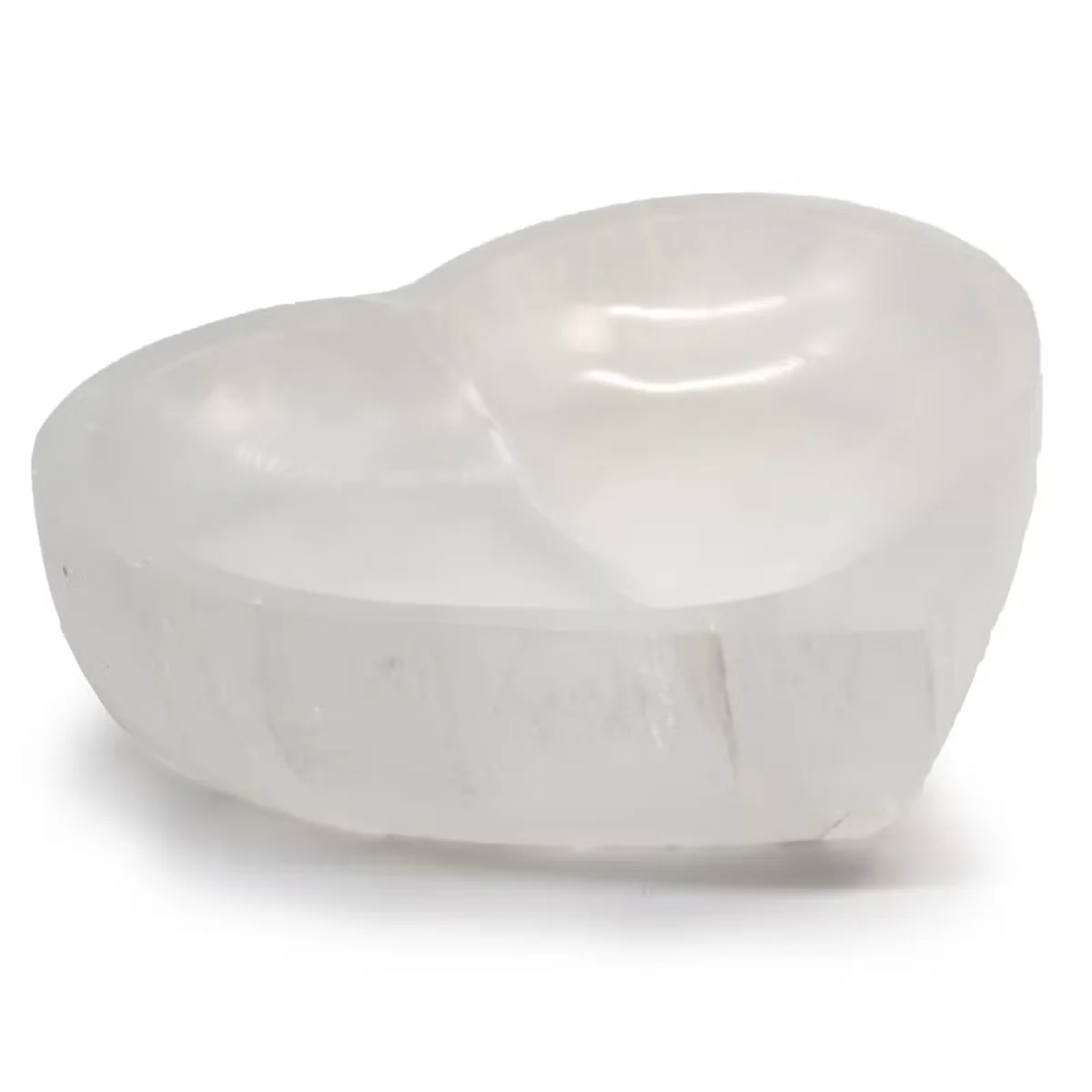 Heart-shaped decorative selenite bowl measuring 15cm, smooth translucent white crystal with natural striations on a white background