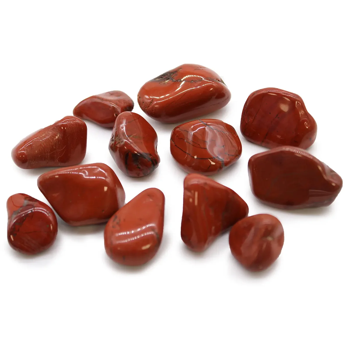 Medium red jasper tumble stones with smooth polished surfaces, medium tumble stones from Africa arranged on white background