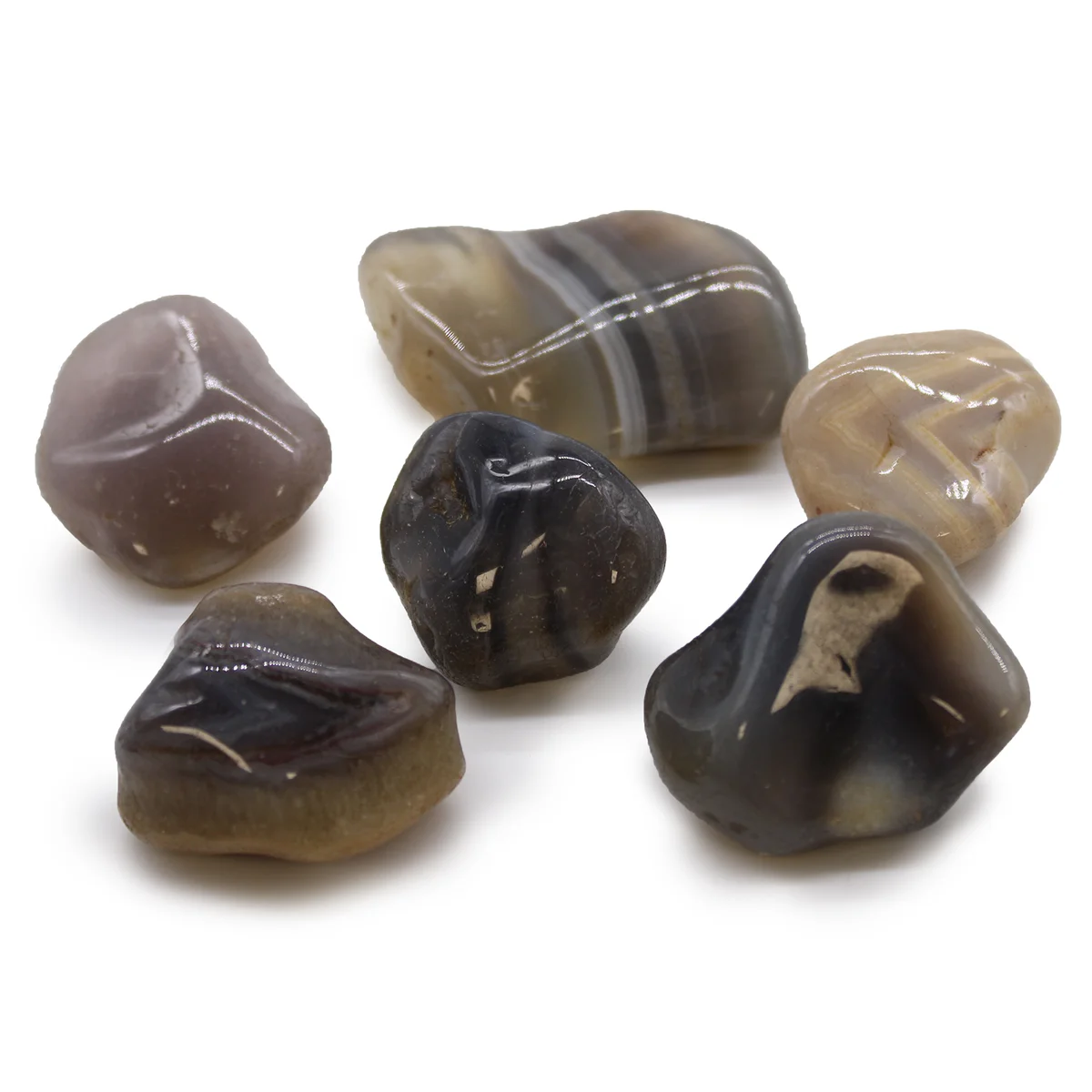 Large polished grey agate decor stones from Botswana, showing smooth surfaces and natural banding patterns