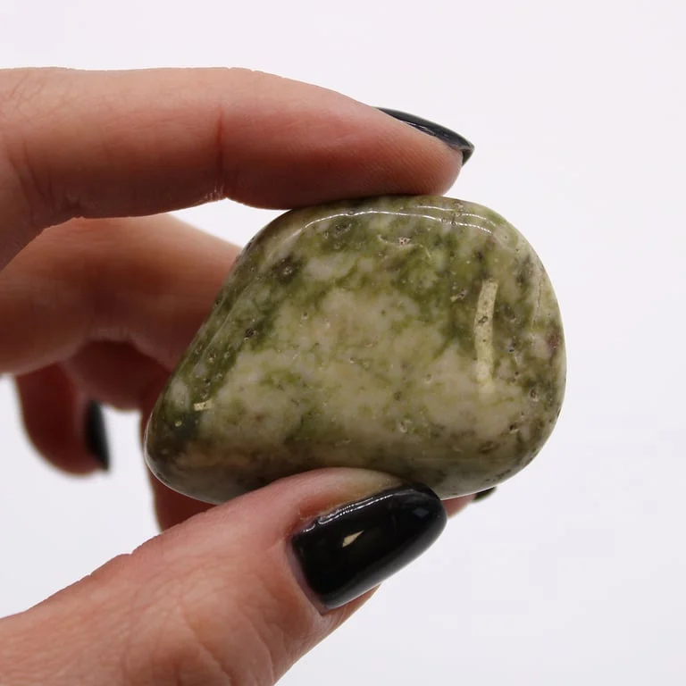 Large African tumble stones with green and blue epidote snowflake stones, displaying textured slick surfaces