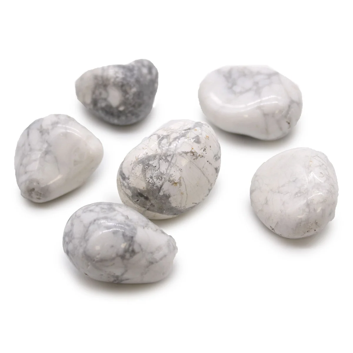 Large white howlite stones polished as large African tumble stones with smooth surfaces and natural patterns