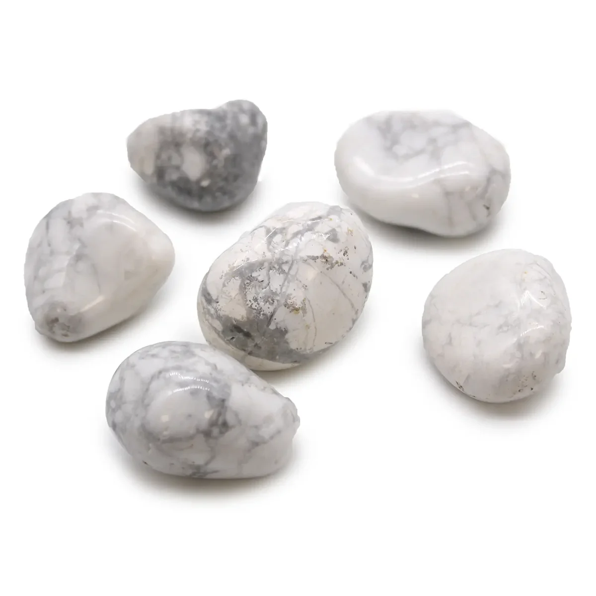 Large white howlite magnesite African tumble stones with smooth polished surfaces on a white background