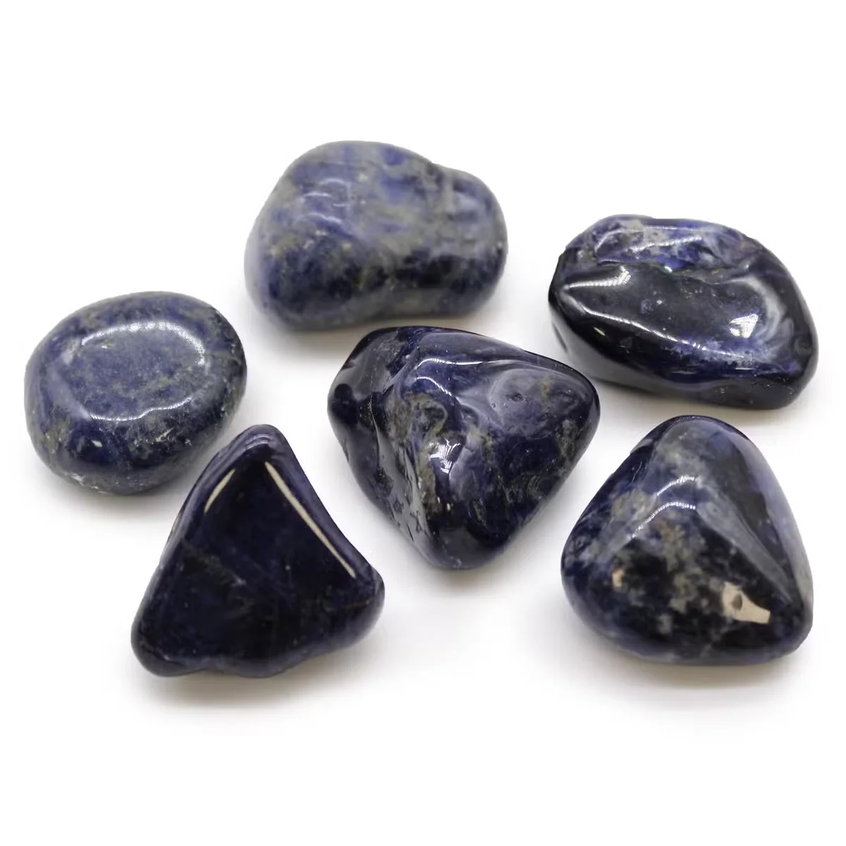 Large pure blue sodalite decorative tumble stones with smooth polished surfaces arranged closely together