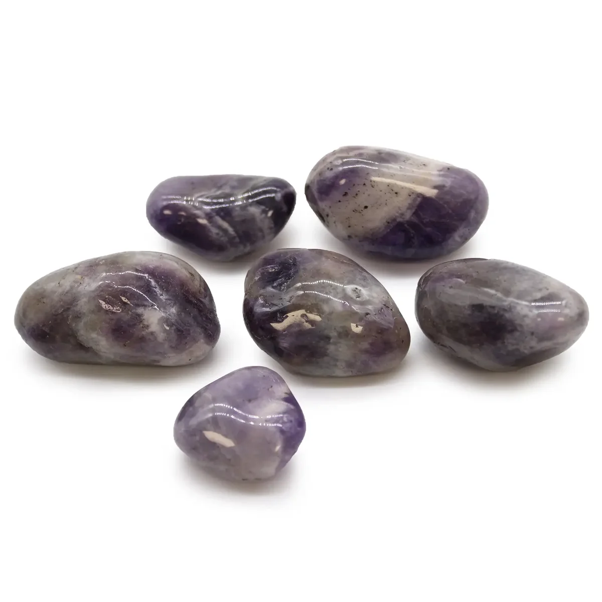 Large polished purple amethyst African tumble stones displayed on a white background
