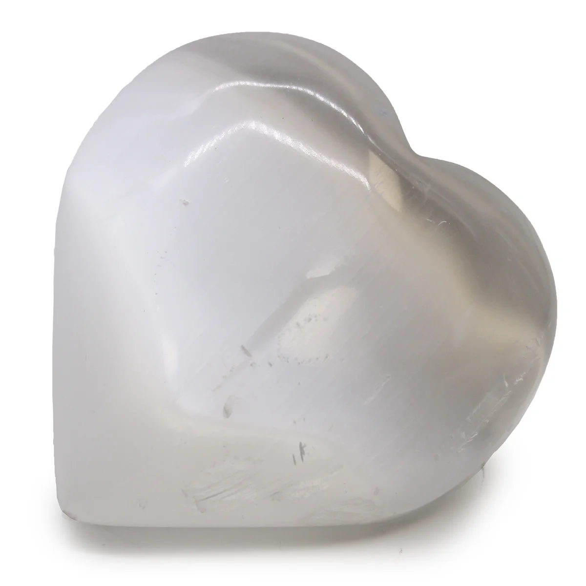 Heart shaped selenite crystal measuring 10 cm with smooth, polished surface and translucent white color