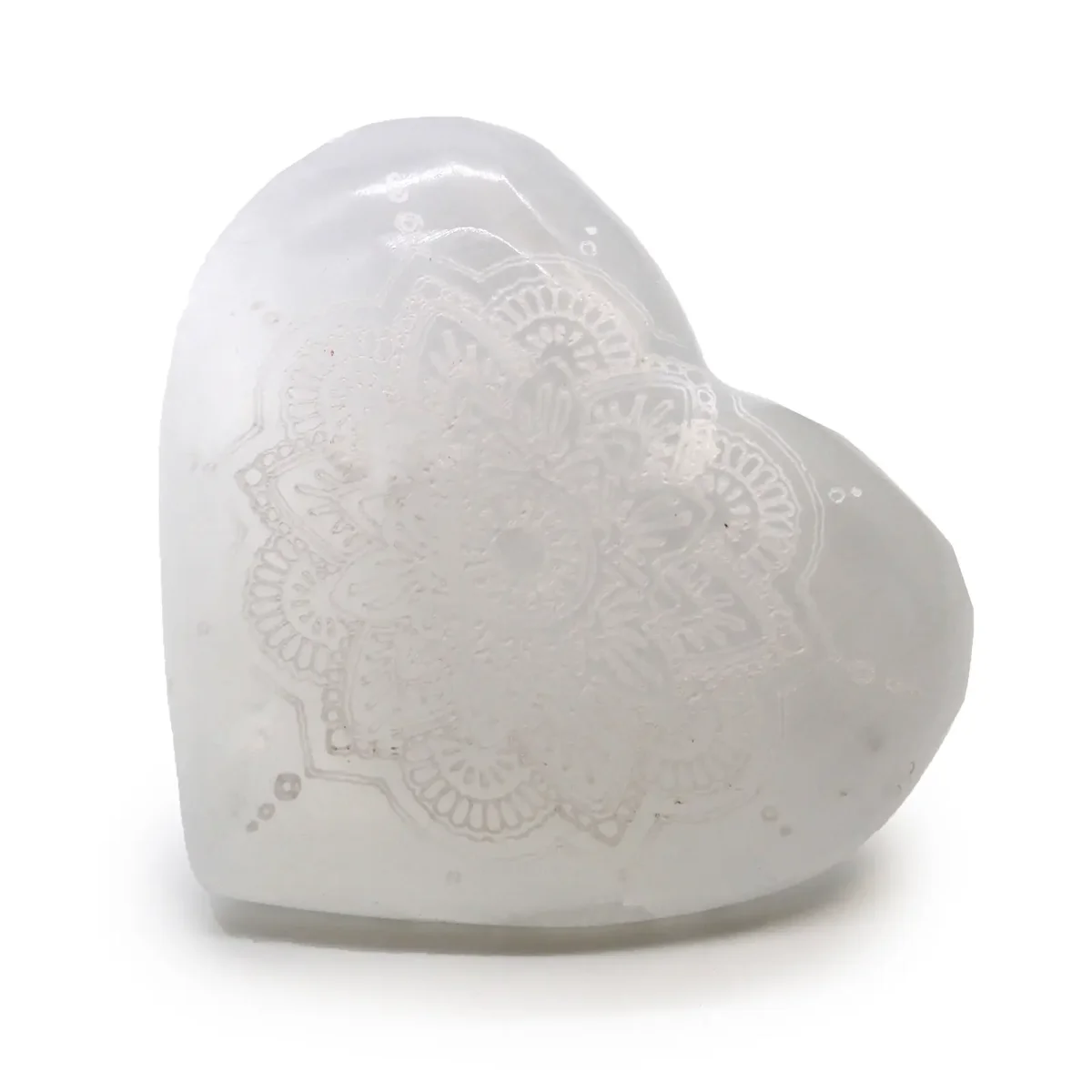 Mandala engraved selenite heart crystal measuring 7-8cm with intricate mandala design on smooth surface