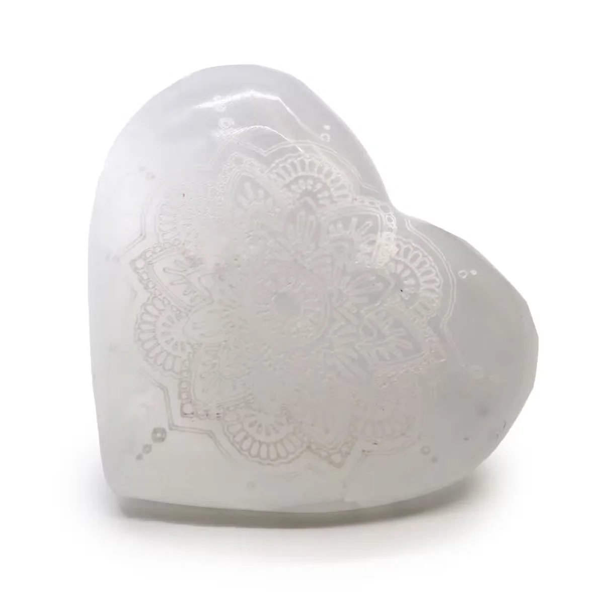 Selenite crystal heart decor 7-8cm with detailed mandala engraving on smooth white surface against plain background