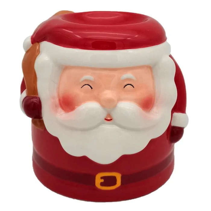 Santa ceramic oil burner shaped like Santa, festive ceramic design with red hat and white beard, used as holiday oil burner.