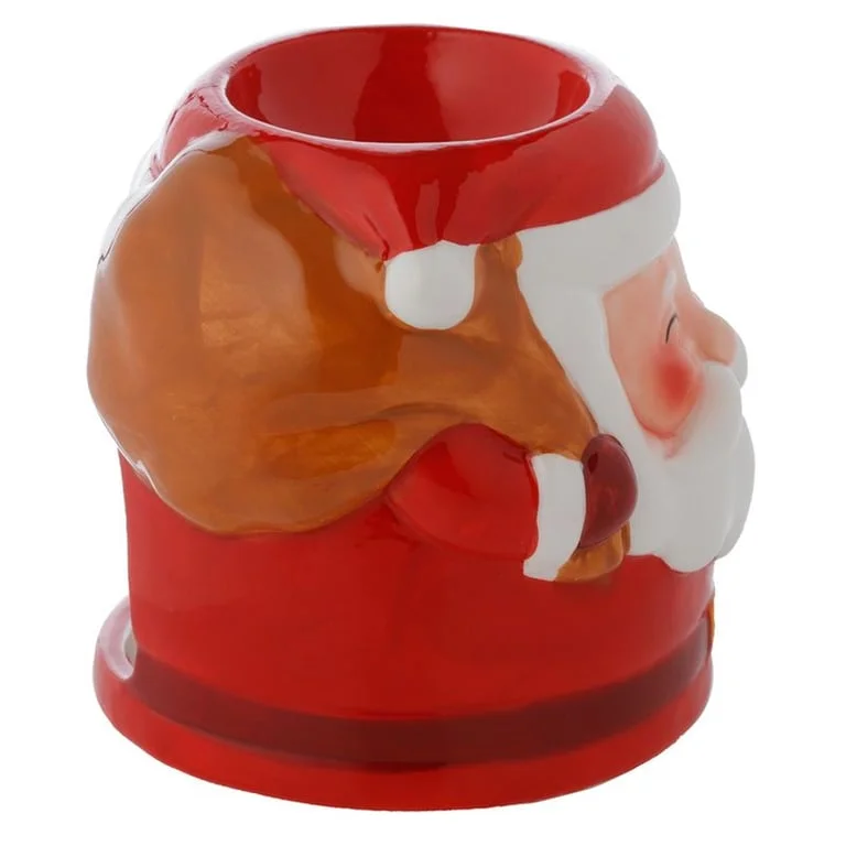 Santa-shaped ceramic oil diffuser, holiday-themed, white ceramic with a red hat and beard, small oil burner candle.