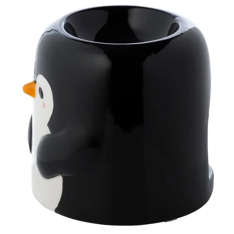 Ceramic oil burner shaped like a penguin, featuring detailed wings and a carved head, resting on a simple stand.