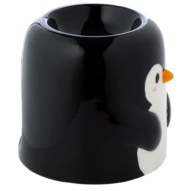 Penguin oil burner: ceramic penguin figure with oil bottle, whimsical home décor.