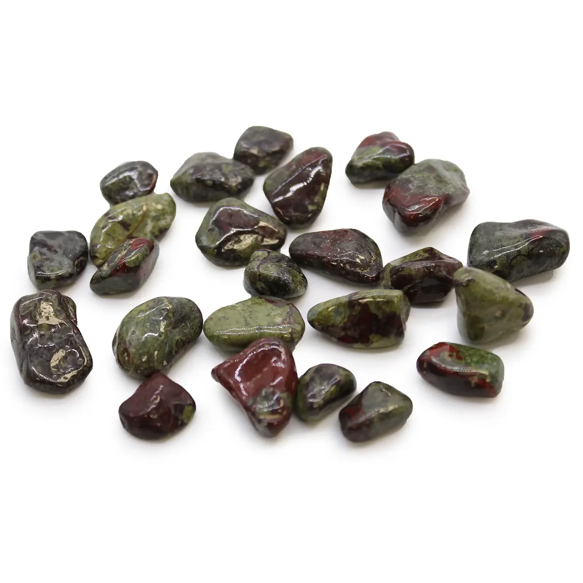 Small polished African dragon stones in various earthy tones arranged on a white background