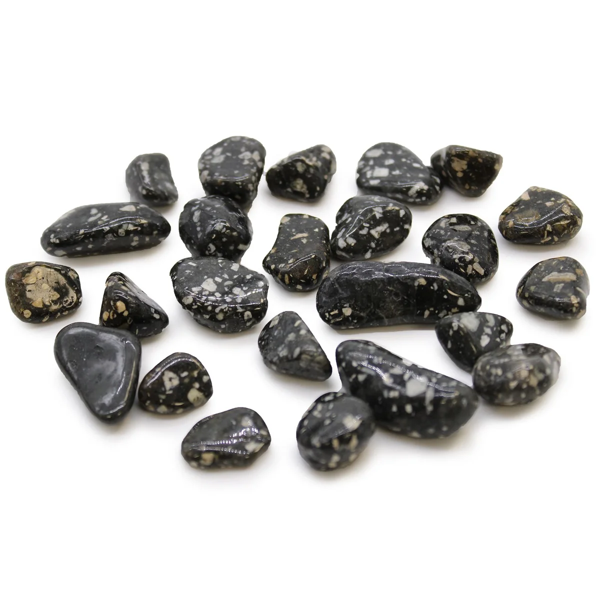 Small African tumble stones featuring guinea fowl pattern in natural earthy colors on a white background