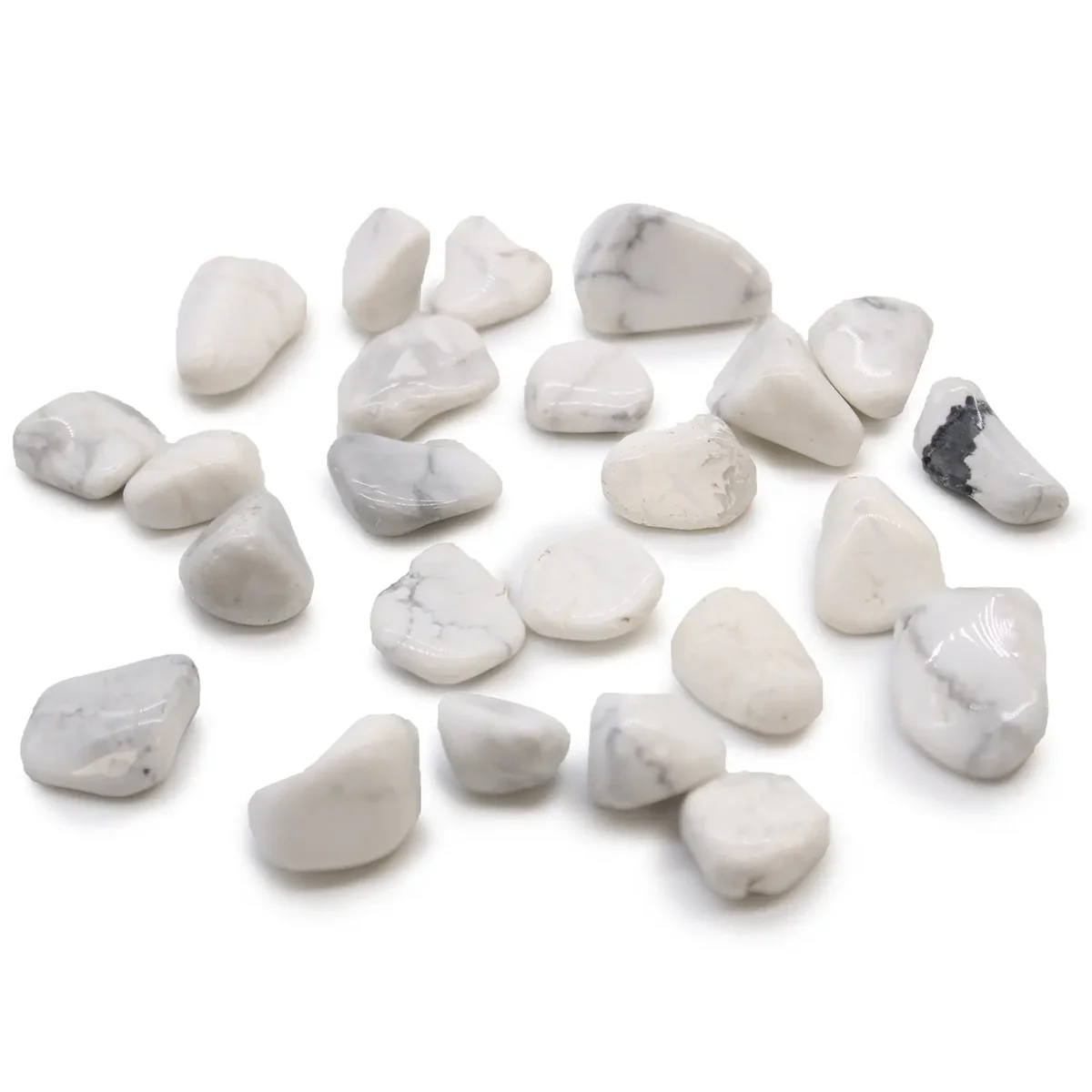 Small white howlite magnesite tumble stones, smooth and polished, small tumble stones from Africa displayed together