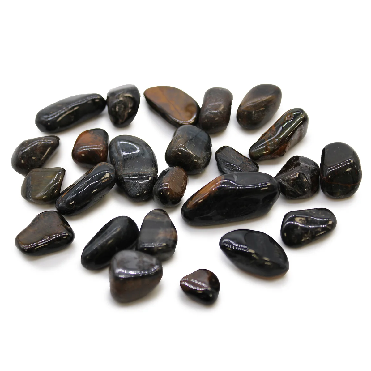 Close-up of small blue Tigers Eye African tumble stones with smooth polished surfaces on a white background