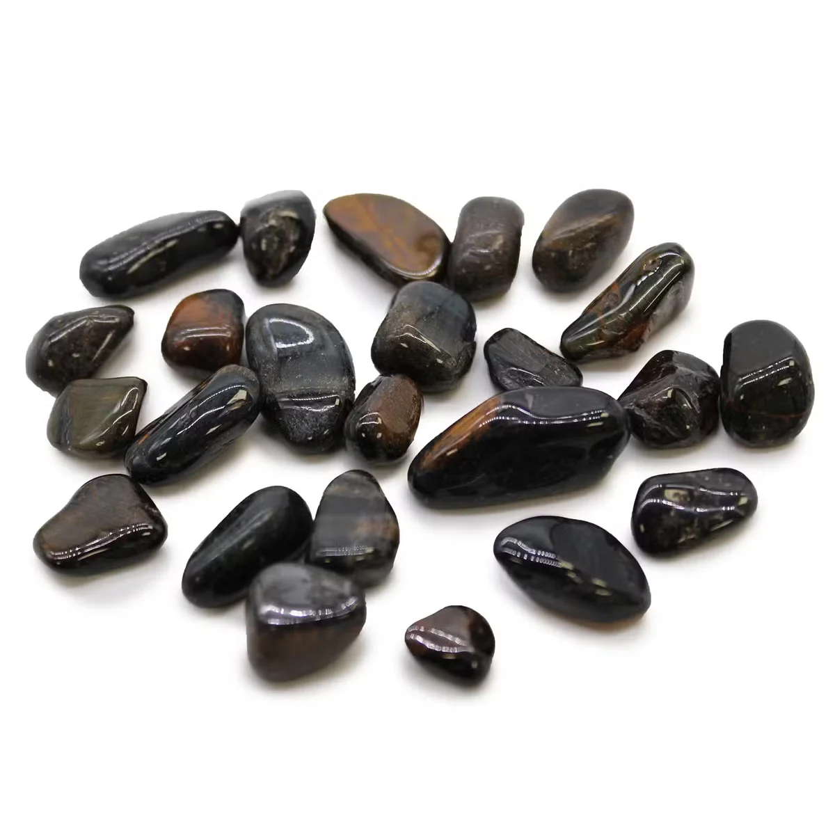 Small blue Tigers Eye decorative tumble stones arranged on a white background, showcasing their polished surfaces