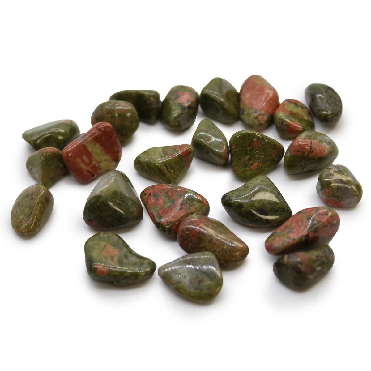 Small polished Unakite decorative tumble stones in earthy green and pink hues arranged on a white background