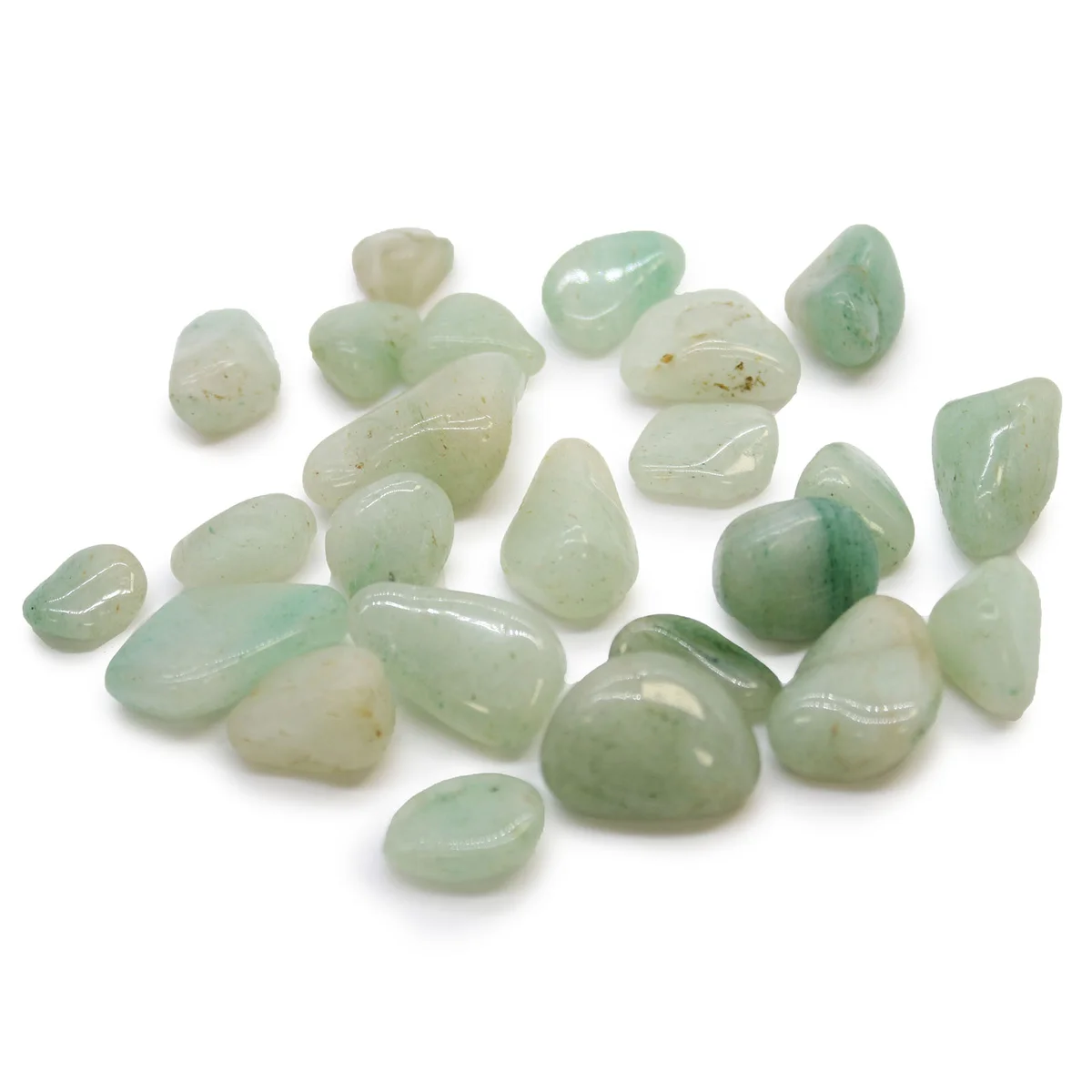 Small polished green aventurine crystals, known as African tumble stones, displayed on a white background