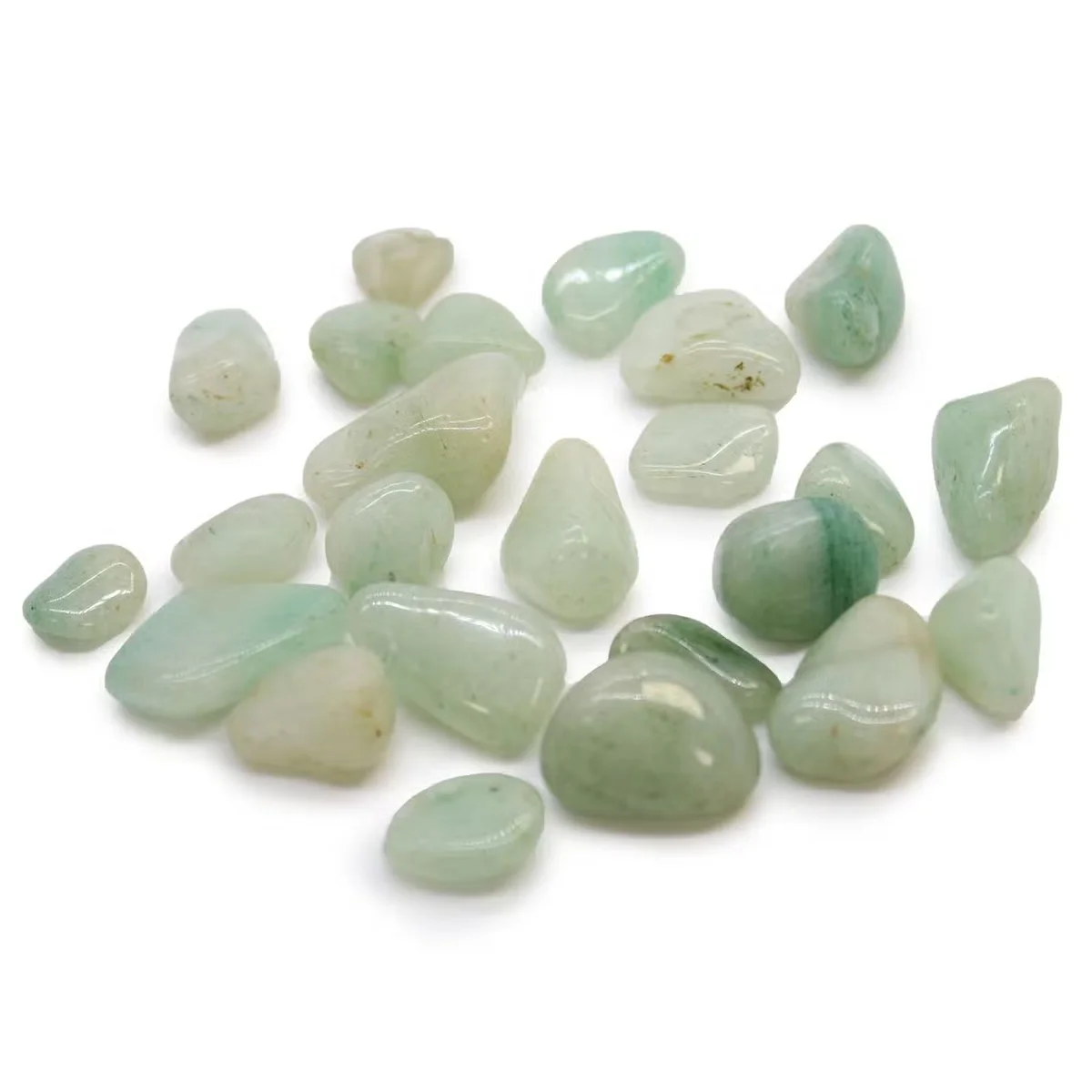 Small polished green Aventurine decorative tumble stones from Africa arranged on white background