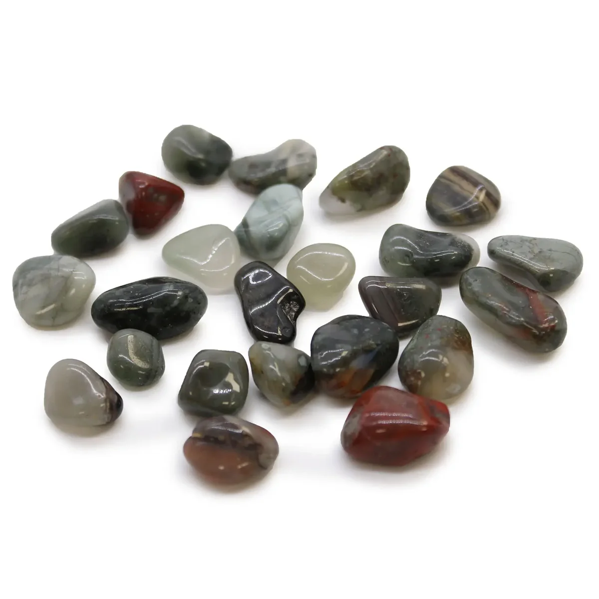 Small tumble stones in deep green and red hues, polished bloodstone from Africa, displayed on a white background