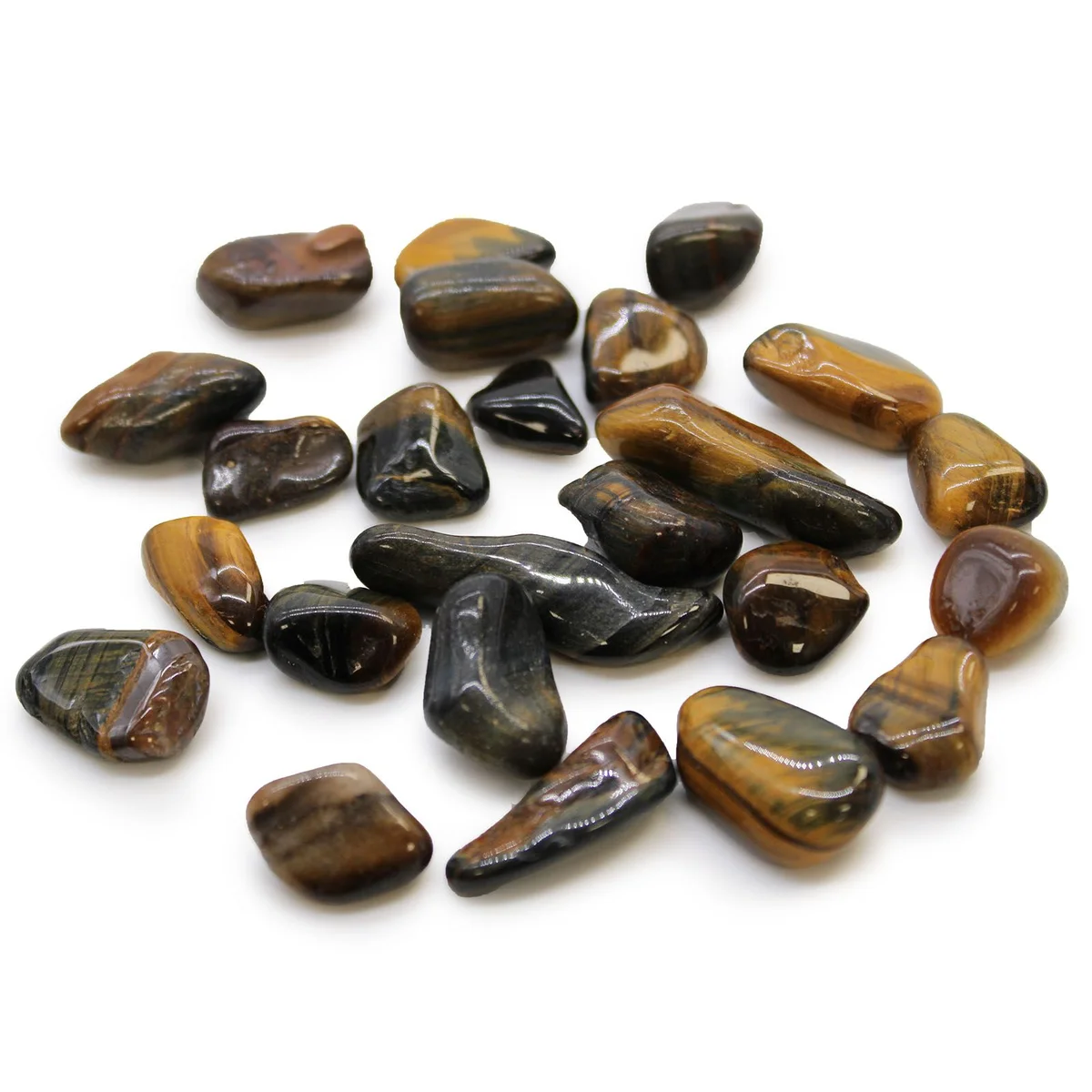 Varigated small tigers eye stones in a pile showing their polished, smooth surfaces and rich brown hues